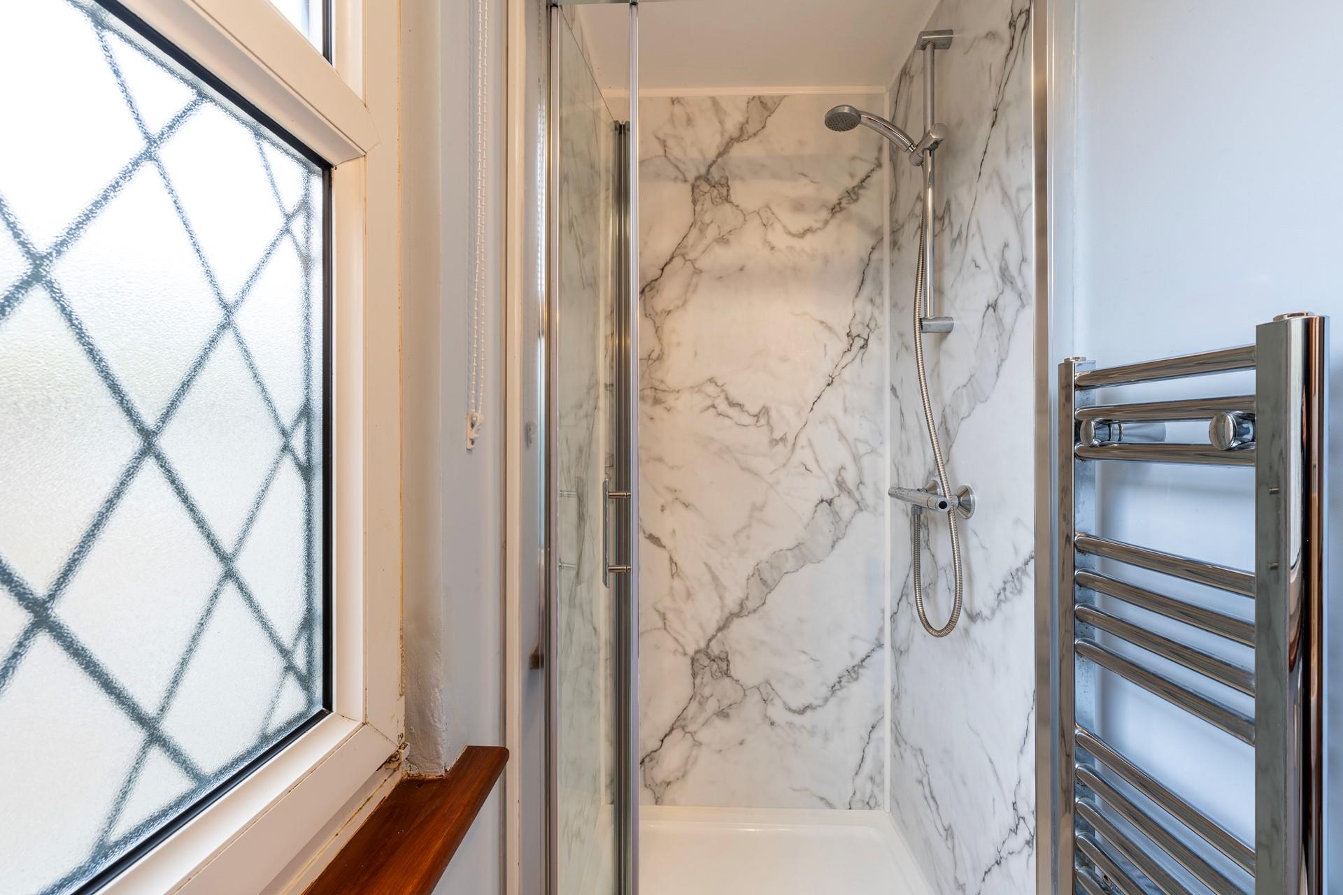 Wash off your sandy toes in the shower after a morning swim at Porthmeor beach.