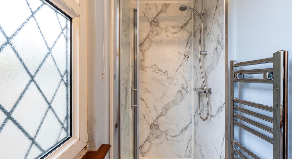 Wash off your sandy toes in the shower after a morning swim at Porthmeor beach.