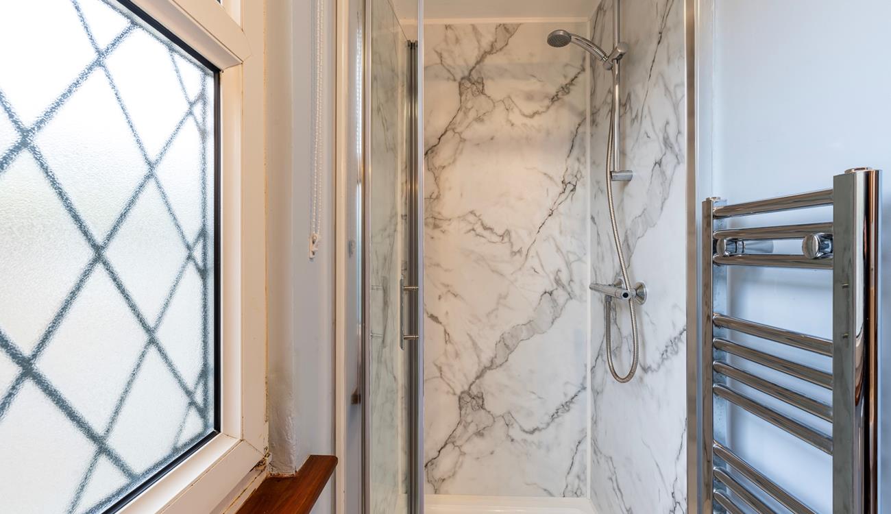 Wash off your sandy toes in the shower after a morning swim at Porthmeor beach.