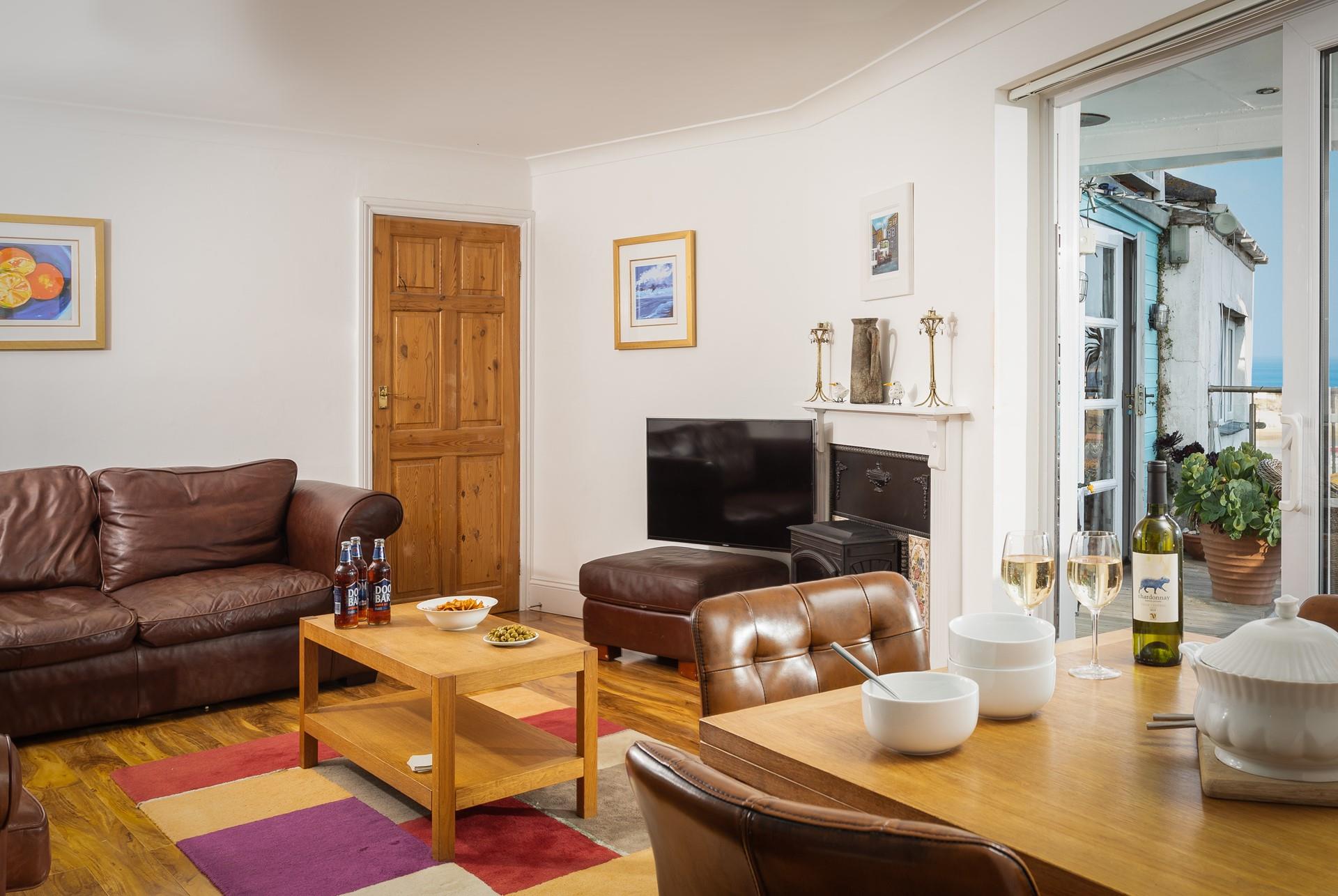 As the evening starts to get chilly wander inside to cosy up on the sofa in front of a good film.