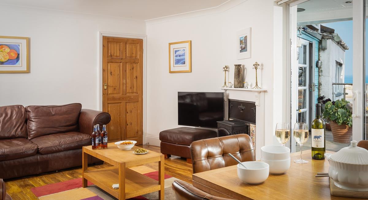 As the evening starts to get chilly wander inside to cosy up on the sofa in front of a good film.