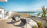Relax on your rooftop sun lounger with a glass of something cold soaking up the sun in front of stunning views of St Ives. - Thumbnail Image