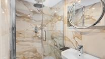 The modern bathroom provides a stylish area to get ready in the morning.