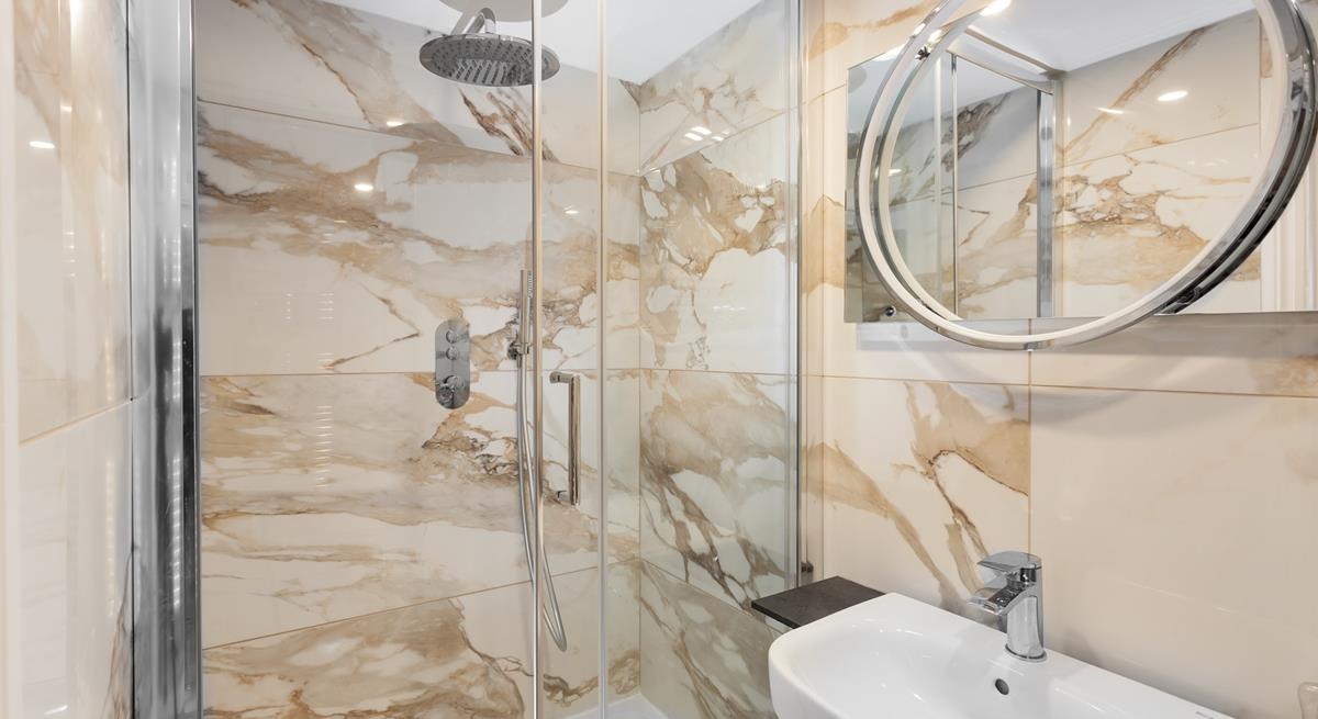 The modern bathroom provides a stylish area to get ready in the morning.