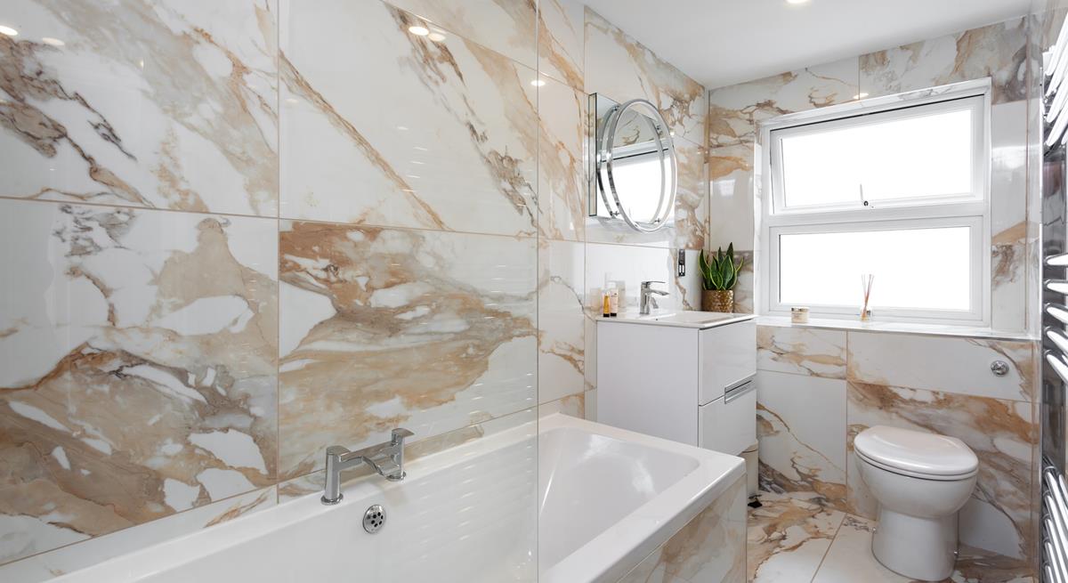 In the winter, after blustery beach walks, come back to run yourself a bubble bath.