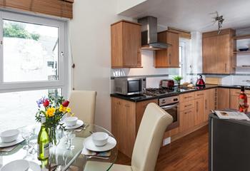 The kitchen/dining area is well-equipped for you to cook delicious meals.