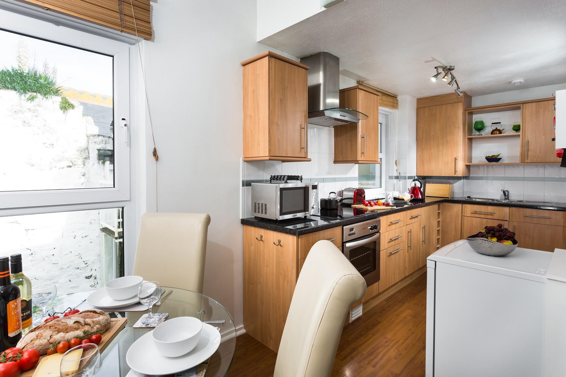 The kitchen/dining area is well-equipped for you to cook delicious meals.