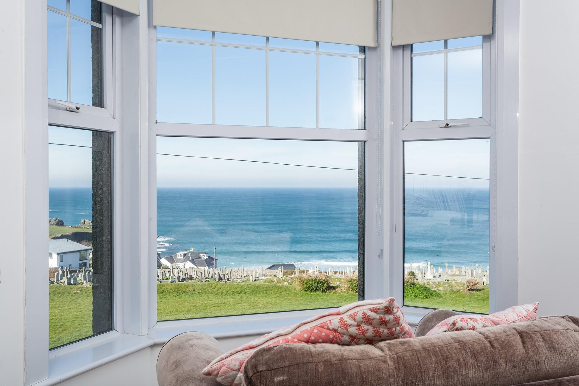Bedroom 1 has a wide bay window which overlooks Porthmeor and much of the coastline.