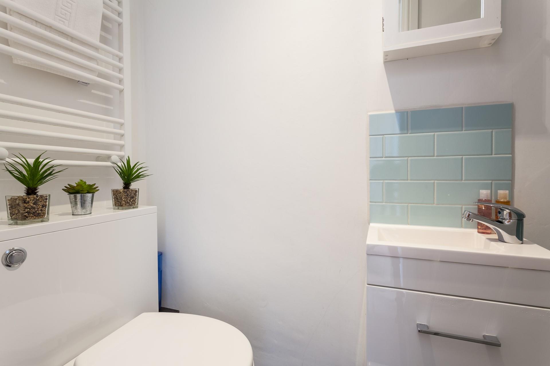 Get ready for the day in the sleek shower room.