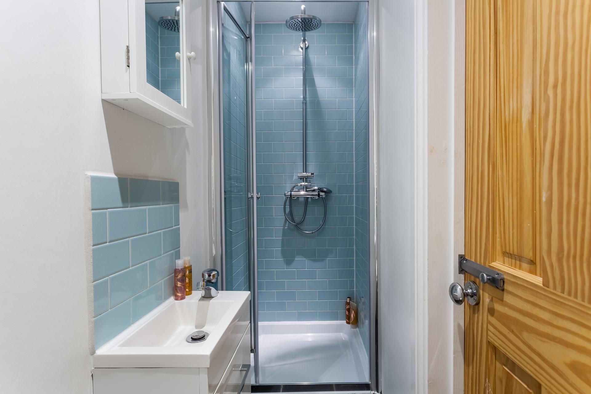 Wash off sandy toes in the shower after a day spent on Porthmeor beach.