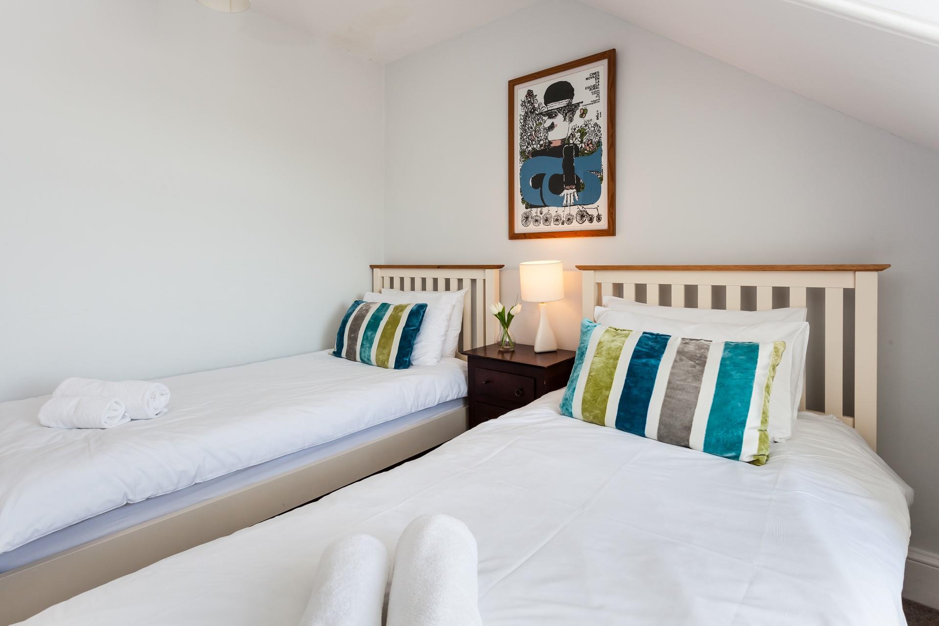 Settle the kids into the twin beds after an exhausting day playing on the beach.