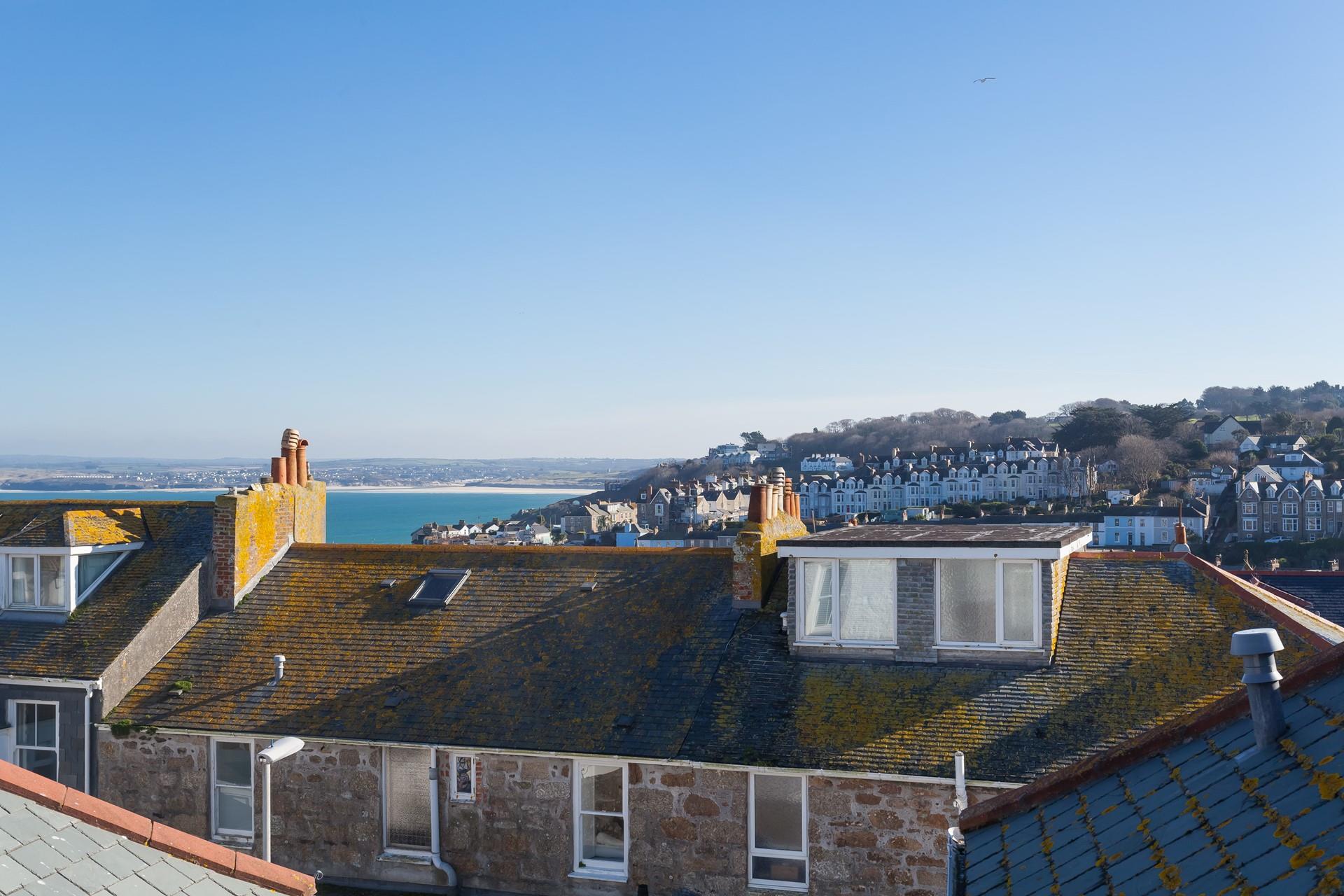 The view stretches as far as Hayle over St Ives quirky rooftops.