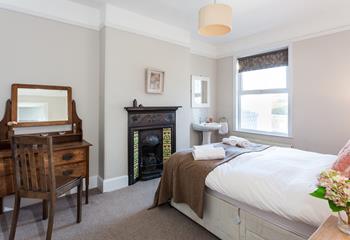 Bedroom 2 has the original cast iron fireplace and provides a cosy base to rest your head.