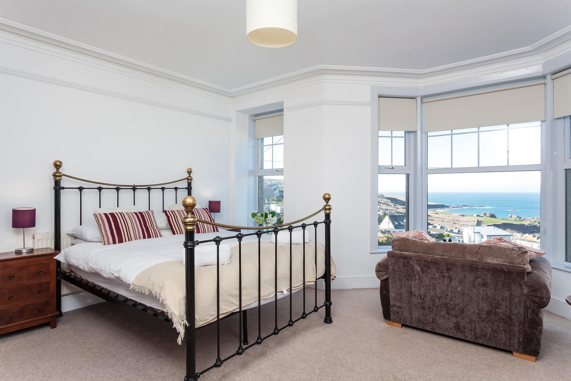Take in the wonderful view from the sumptuous king size bed or cosy armchair.