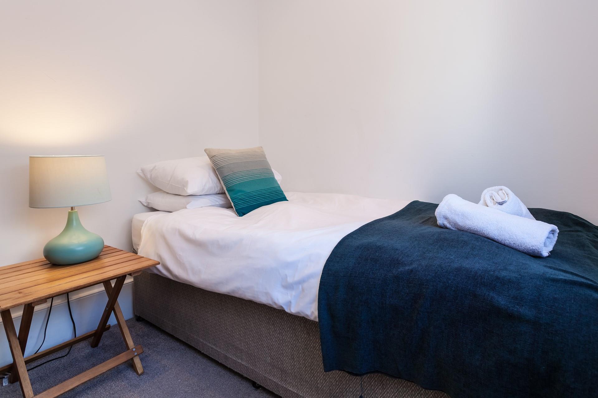Bedroom 3 has a single bed perfect for young adults or children.