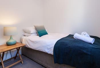 Bedroom 3 has a single bed perfect for young adults or children.