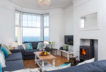 Perfectly cosy, the sitting room offers stunning views and a crackling woodburner, what more could you want?