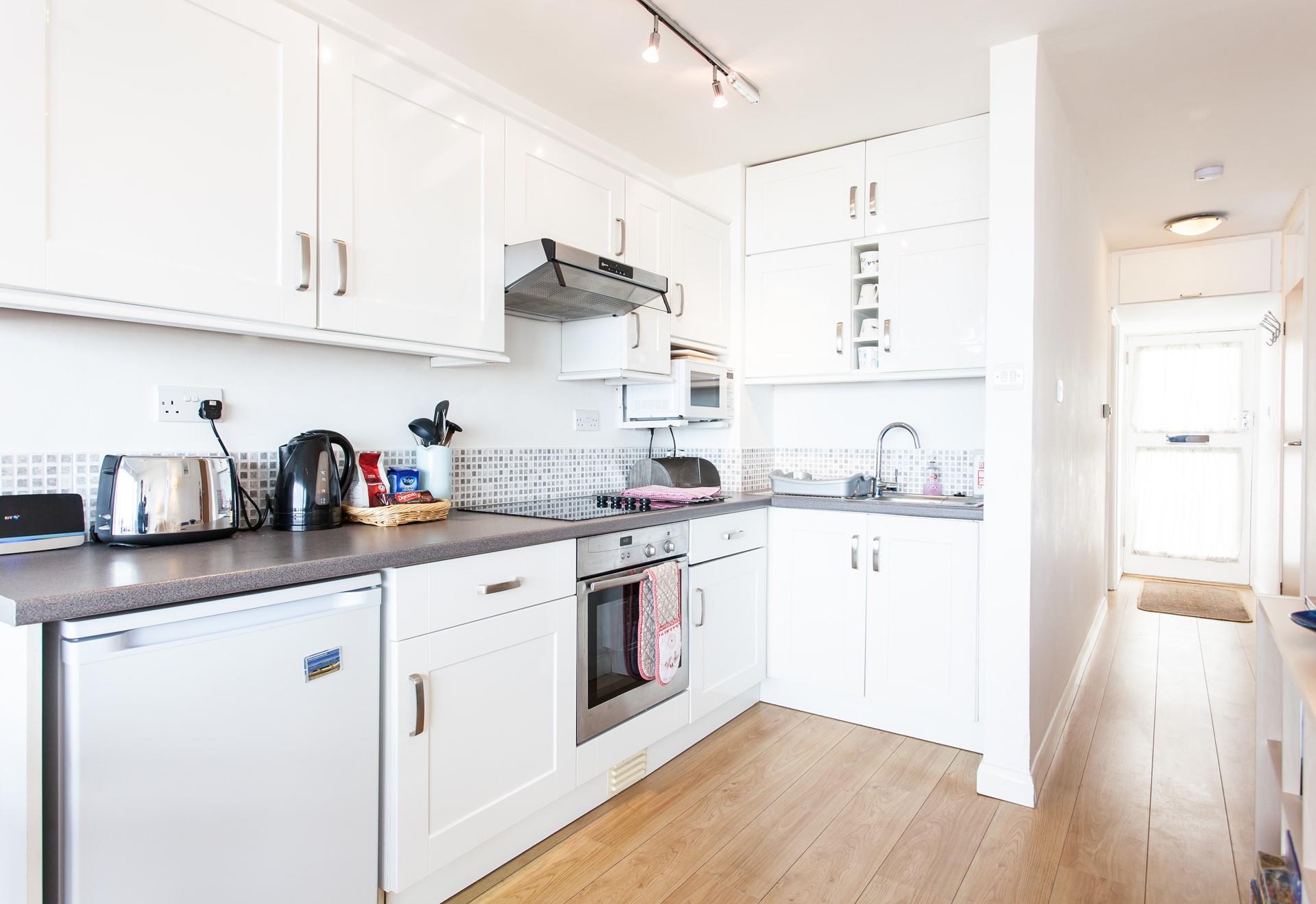 Cook up dinner in the kitchen and watch the sunset glow while you eat.