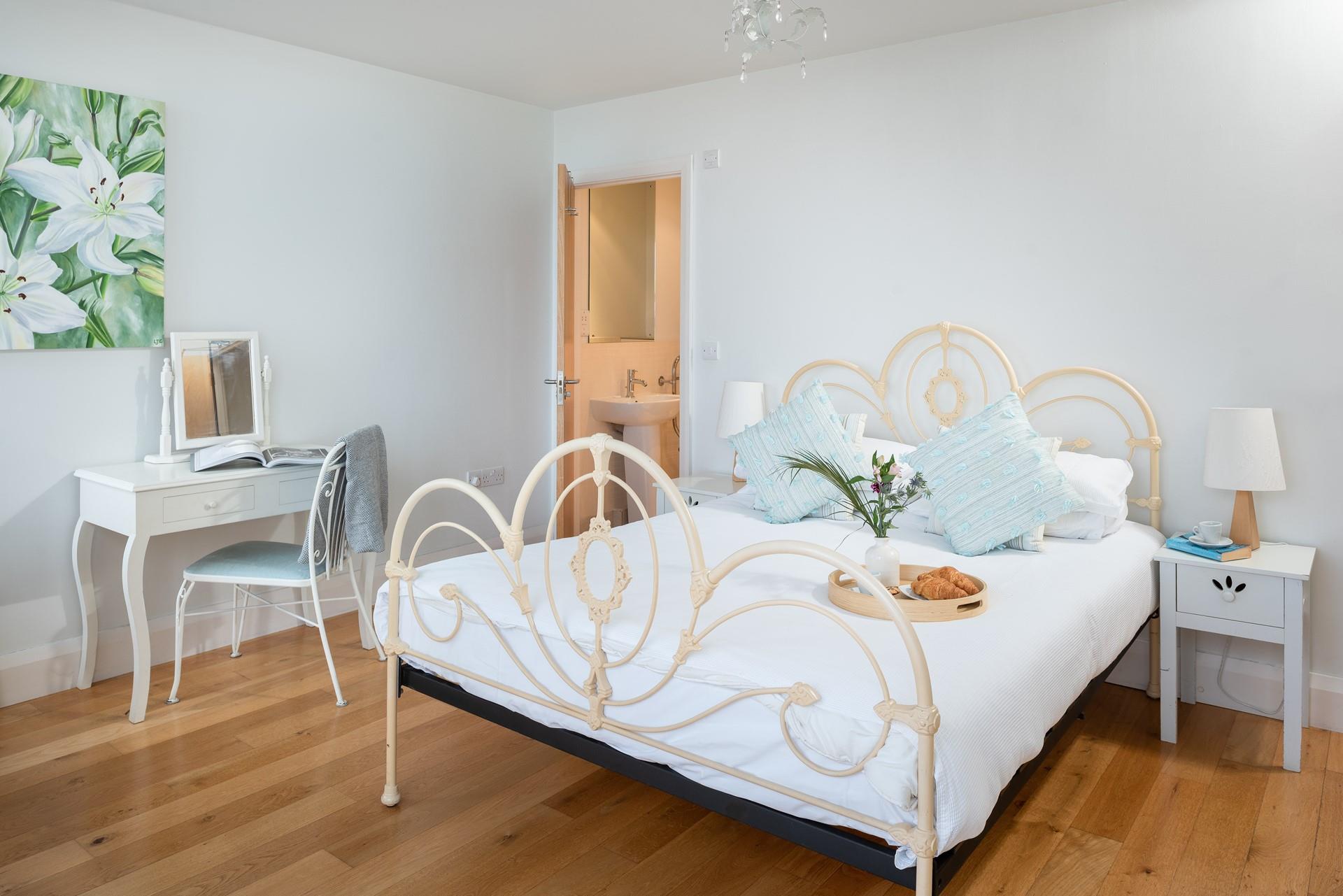 Bedroom 1 has a spacious king size bed, perfect for breakfast in bed.