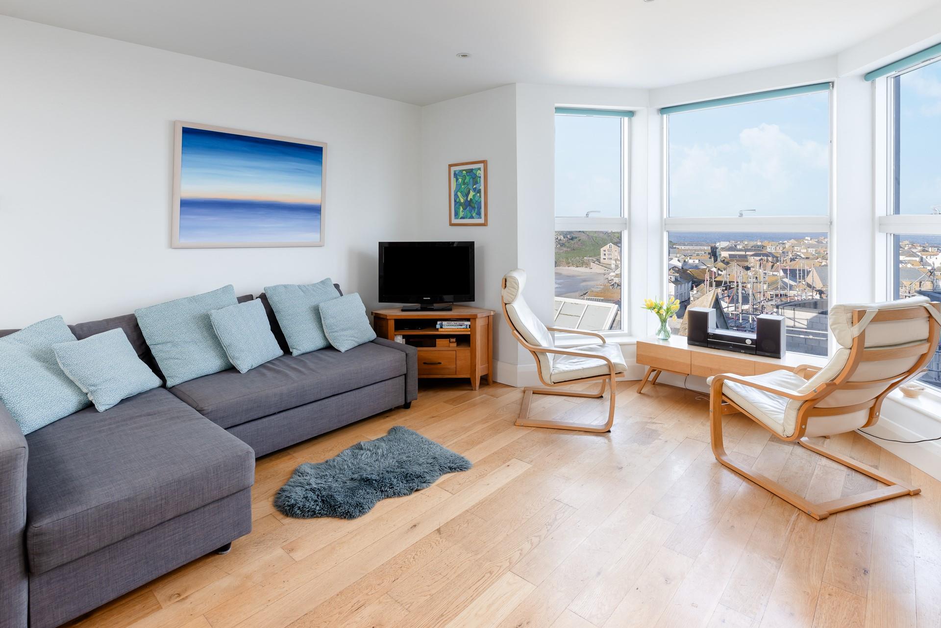 Curl up on the sofa with a book after a day by the sea. 