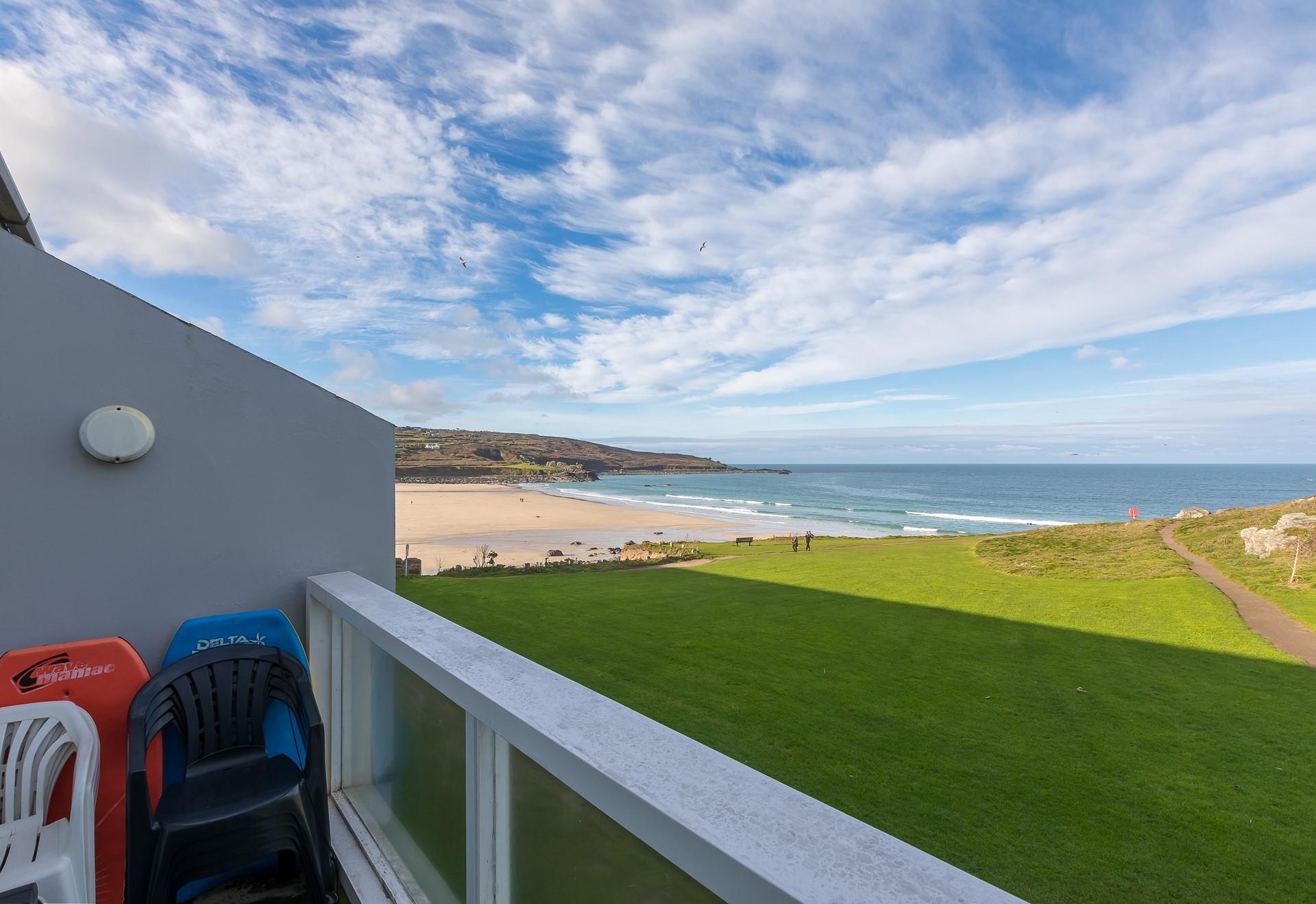 Sit out on the balcony and watch the sun go down with a glass of wine in hand.