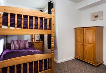 All the bedrooms have a deep purple theme which provides a pop of colour.