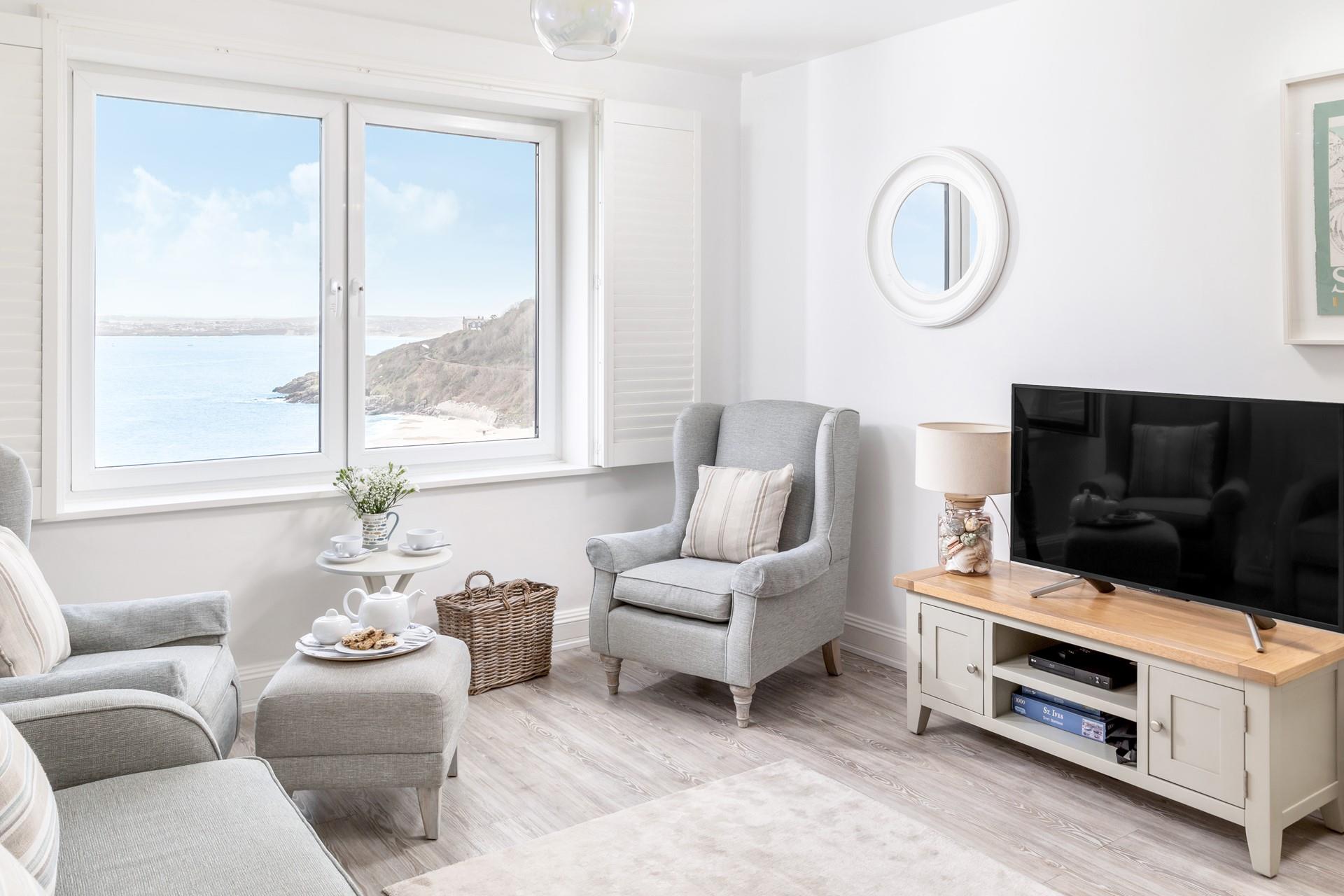 Relax on the armchairs and treat yourself to a glass of something chilled whilst enjoying the sea views.