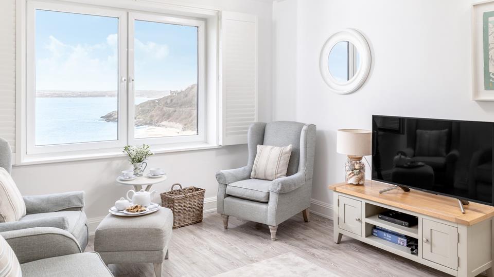 Relax on the armchairs and treat yourself to a glass of something chilled whilst enjoying the sea views.