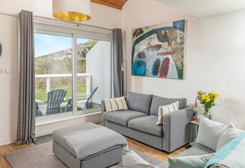 Put your feet up in the cosy living room after a day on the beach.