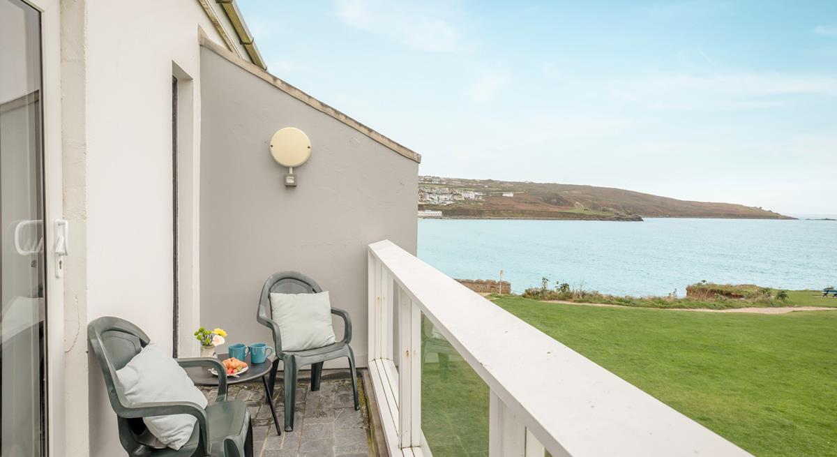 Grab your morning coffee and listen to the waves crash against the rocks on your balcony.