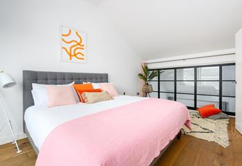 Bedroom 1 has bright pops of colour and is the perfect base to rest.