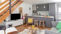 The open plan layout means you can cook, dine, and unwind together.