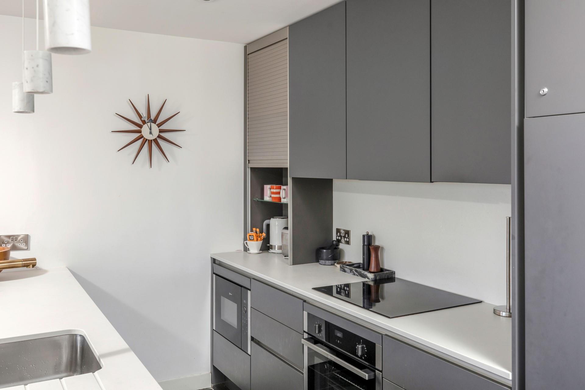 The sleek kitchen has all the modern amenities you need.