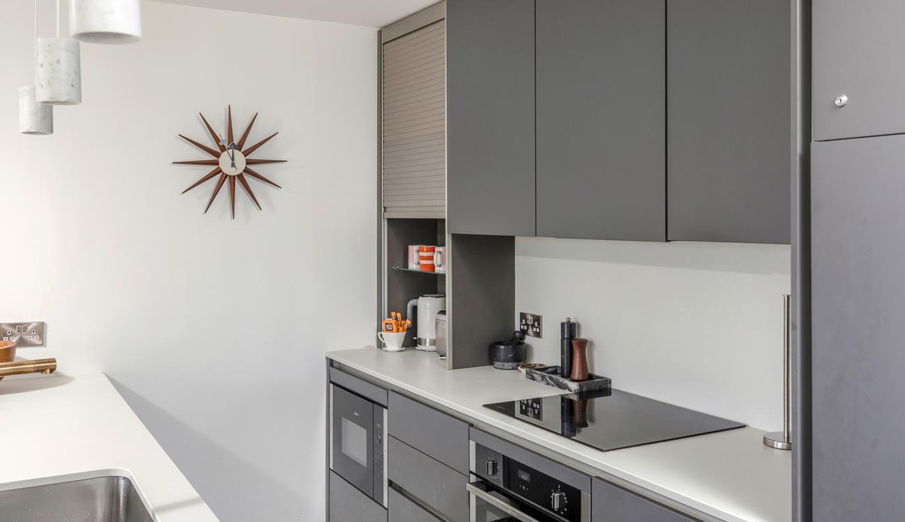 The sleek kitchen has all the modern amenities you need.