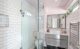 The bathroom is modern and fresh with a walk in shower. - Thumbnail Image