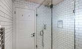 Wash away sandy beach days in the rainfall shower. - Thumbnail Image