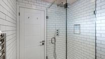 Wash away sandy beach days in the rainfall shower.