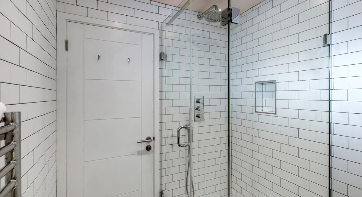 Wash away sandy beach days in the rainfall shower.