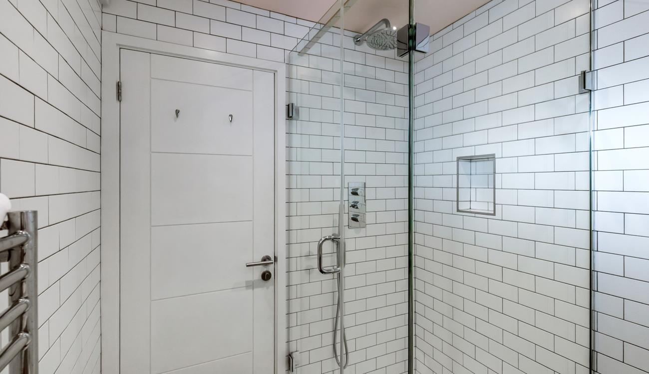 Wash away sandy beach days in the rainfall shower.