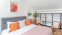 Pops of colour brighten the light and airy bedroom.