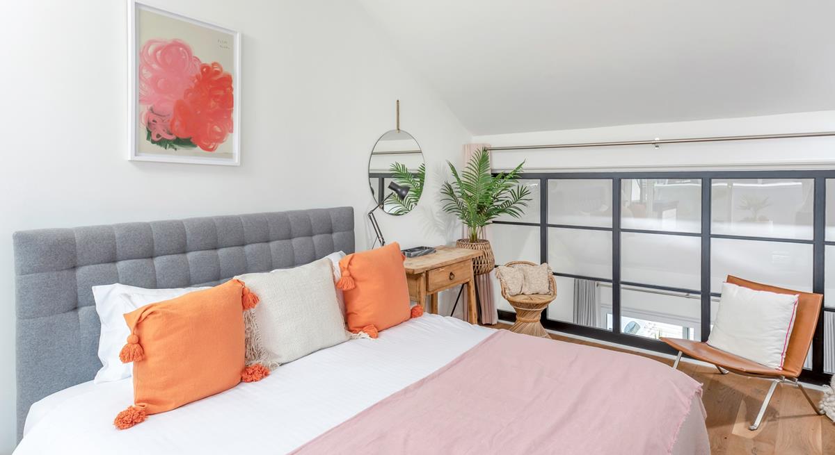 Pops of colour brighten the light and airy bedroom.