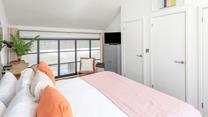The bedroom has soft sheets and plump pillows for a relaxing night's sleep.