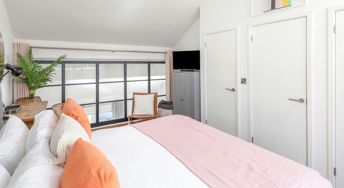 The bedroom has soft sheets and plump pillows for a relaxing night's sleep.