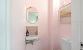 The handy cloakroom decorated in subtle hues. - Thumbnail Image