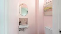 The handy cloakroom decorated in subtle hues.