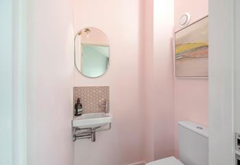 The handy cloakroom decorated in subtle hues.