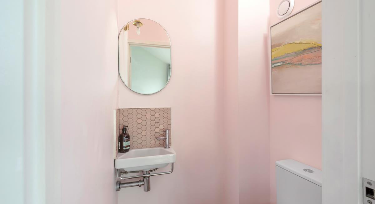 The handy cloakroom decorated in subtle hues.