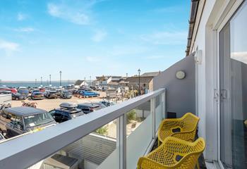 From the living area, the front balcony has sea views.