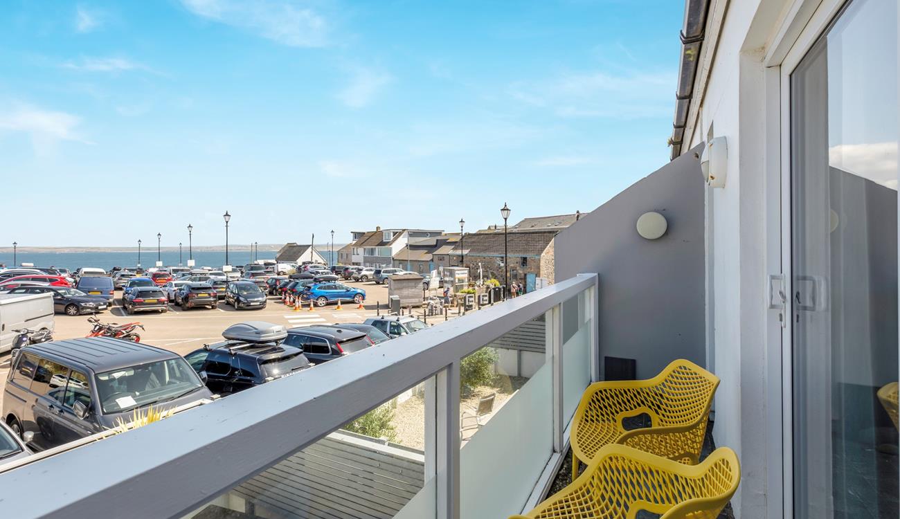 From the living area, the front balcony has sea views.