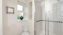 The family bathroom has a large walk-in rainfall shower.